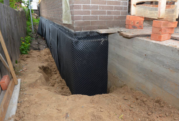 Happy homeowners after waterproofing job in Stow